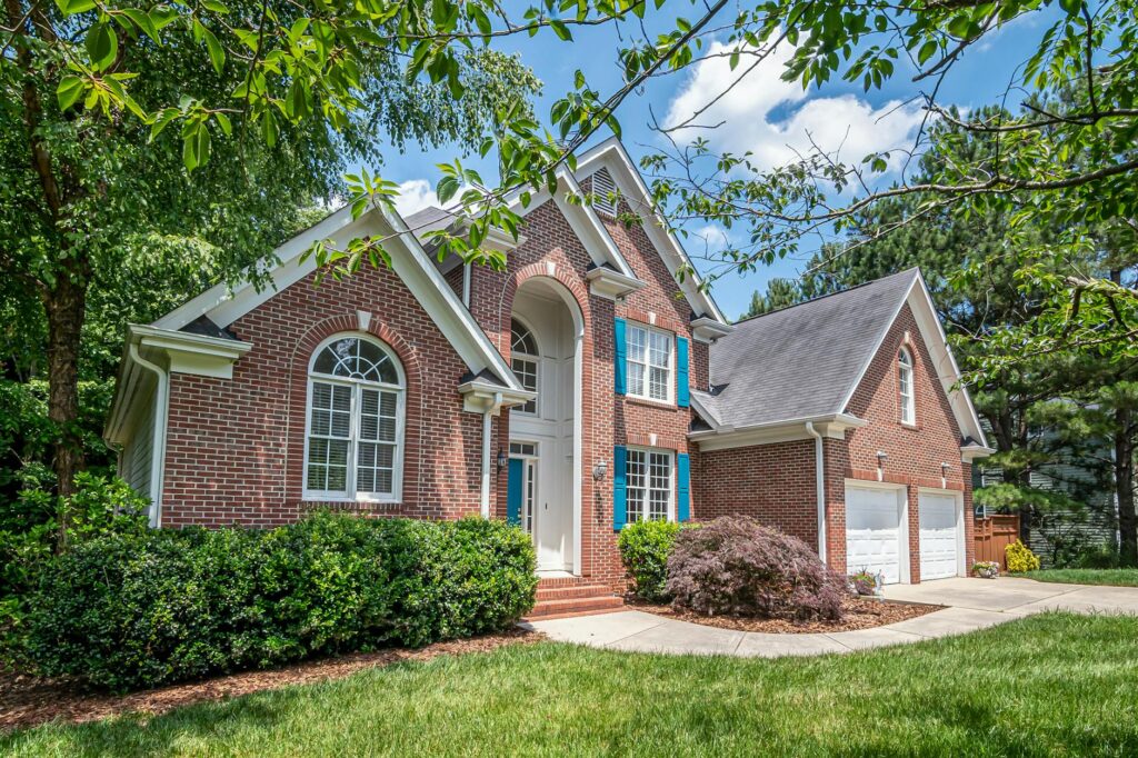 A mature shade tree anchoring the front yard of a Middletown NJ home in spring