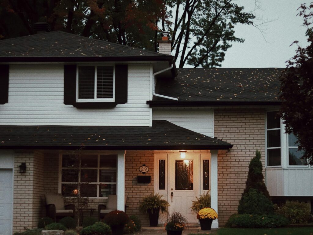 An ISA-certified arborist reviews a tree concern with a homeowner — professional assessment before storm season