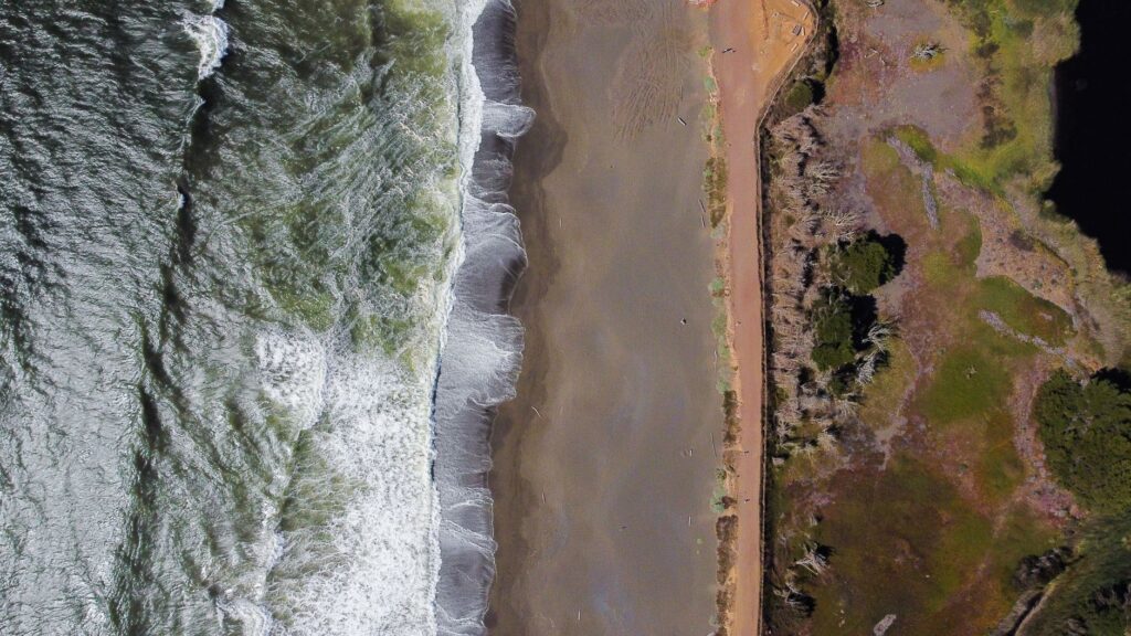 Aerial view of a tree-lined Bayshore neighborhood near a tidal creek in Middletown Township NJ