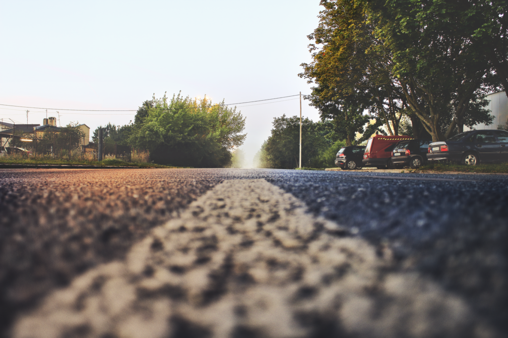 Heat shimmering off an asphalt driveway on a hot summer afternoon