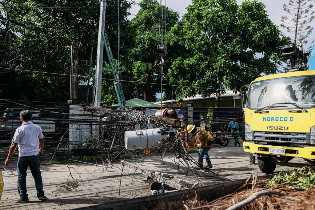 A tree service crew reviewing paperwork and credentials beside their work truck