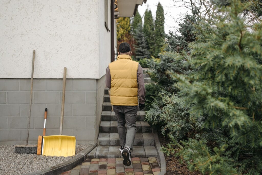 Homeowner walking a backyard and noting details about each tree