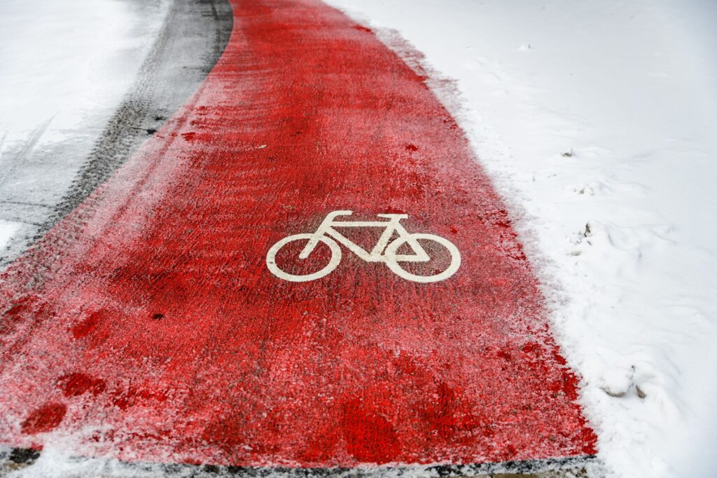 Rock salt spread on an icy residential driveway